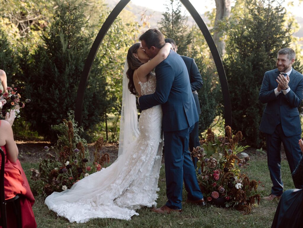 Newlyweds kiss at Bloomsbury Farm wedding near Nashville TN.